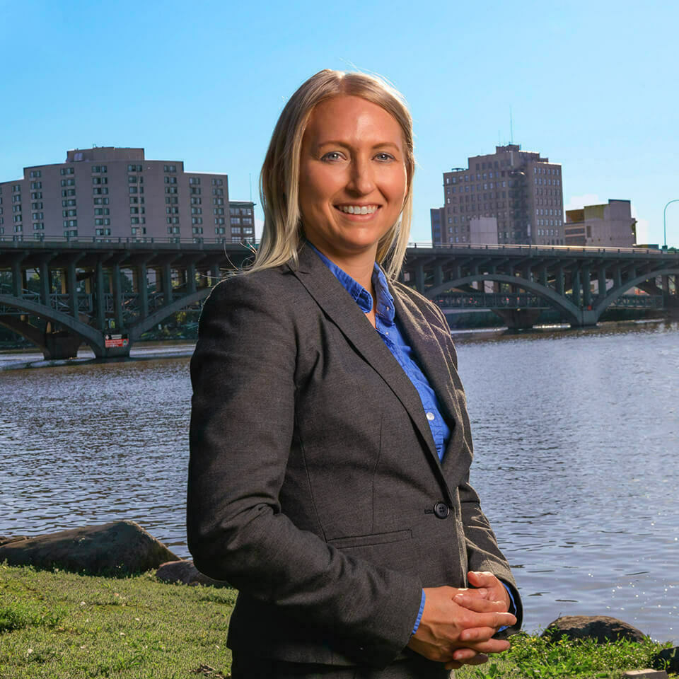 Headshot of Stephanie Seibold with outdoor background