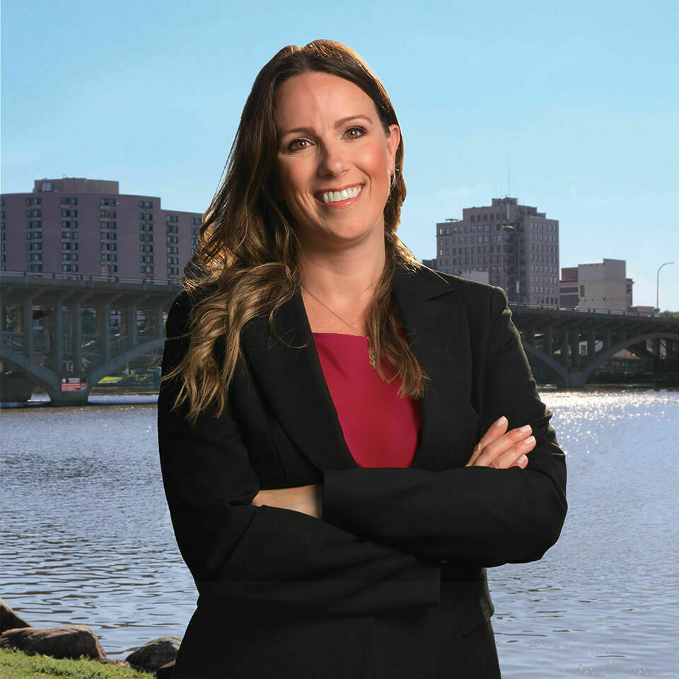 Headshot of Tracy Jones with outdoor background.