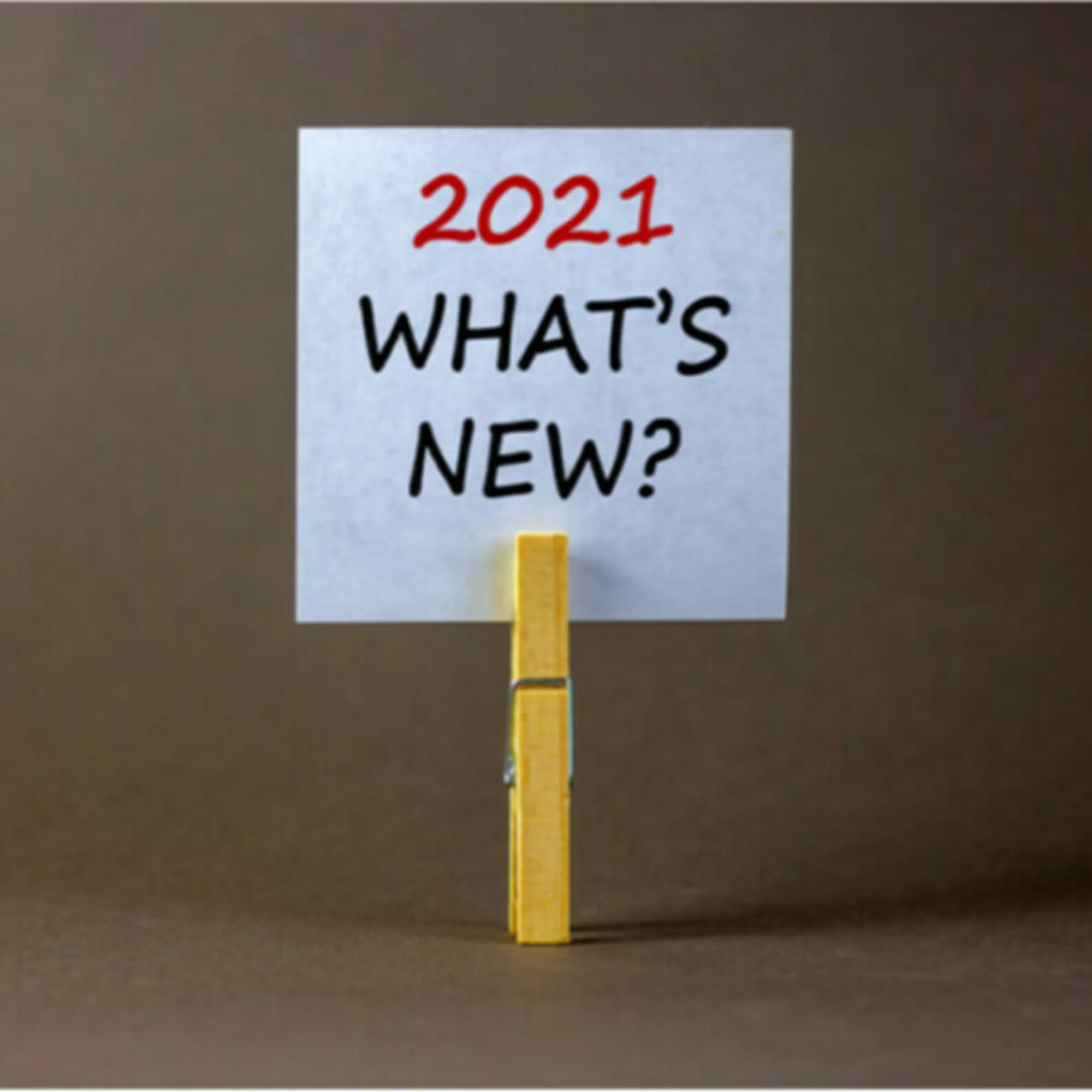 Small paper sign that says "2021 WHAT's NEW?"
