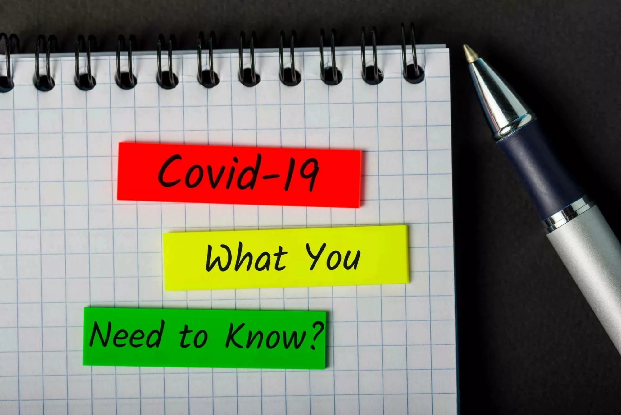 Paper and pen with text "COVID-19 What you need to know?"