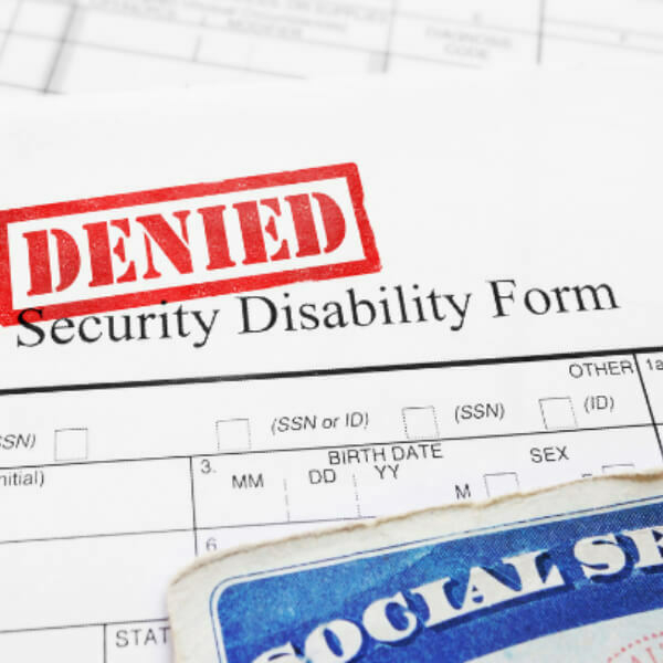 Security disability form with red "DENIED" stamp.
