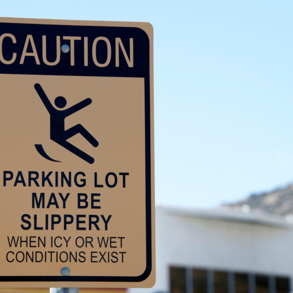"Caution parking lot may be slippery" sign.